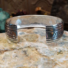 Sterling silver overlay cuff bracelet with repeating geometric motifs and oxidized detailing.