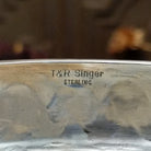 Close up of the artists stamped signatures.