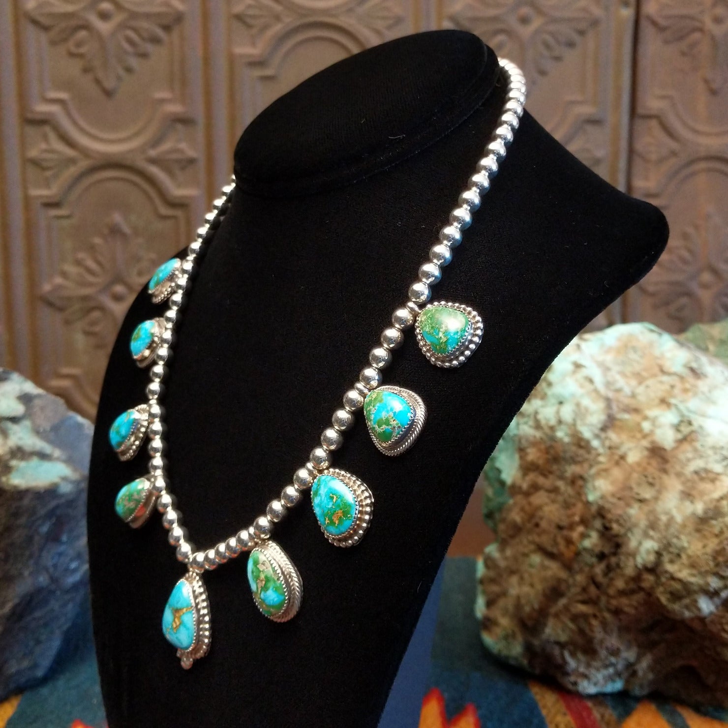 Sterling silver necklace with Sonoran Gold turquoise set in notched bezels, framed by dotted accents and a beaded silver chain.