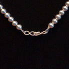 Close-up of the hook clasp on the necklace.