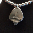 Close-up of the artisan's stamped signature.