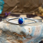 Sterling silver cuff with azurite malachite set in an oval bezel, framed by twisted rope accents.