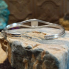 Sterling silver cuff with azurite malachite set in an oval bezel, framed by twisted rope accents.