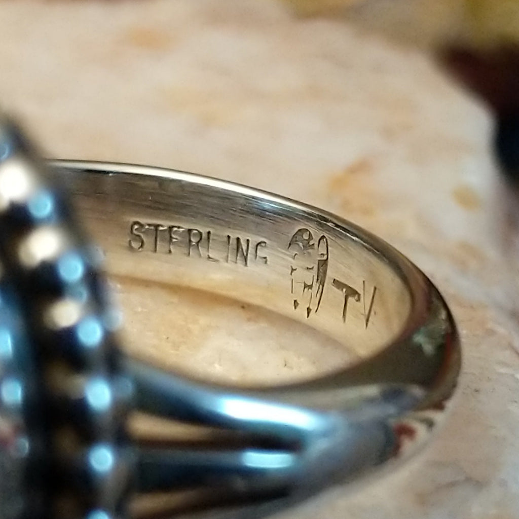 The artisan's stamped signature.