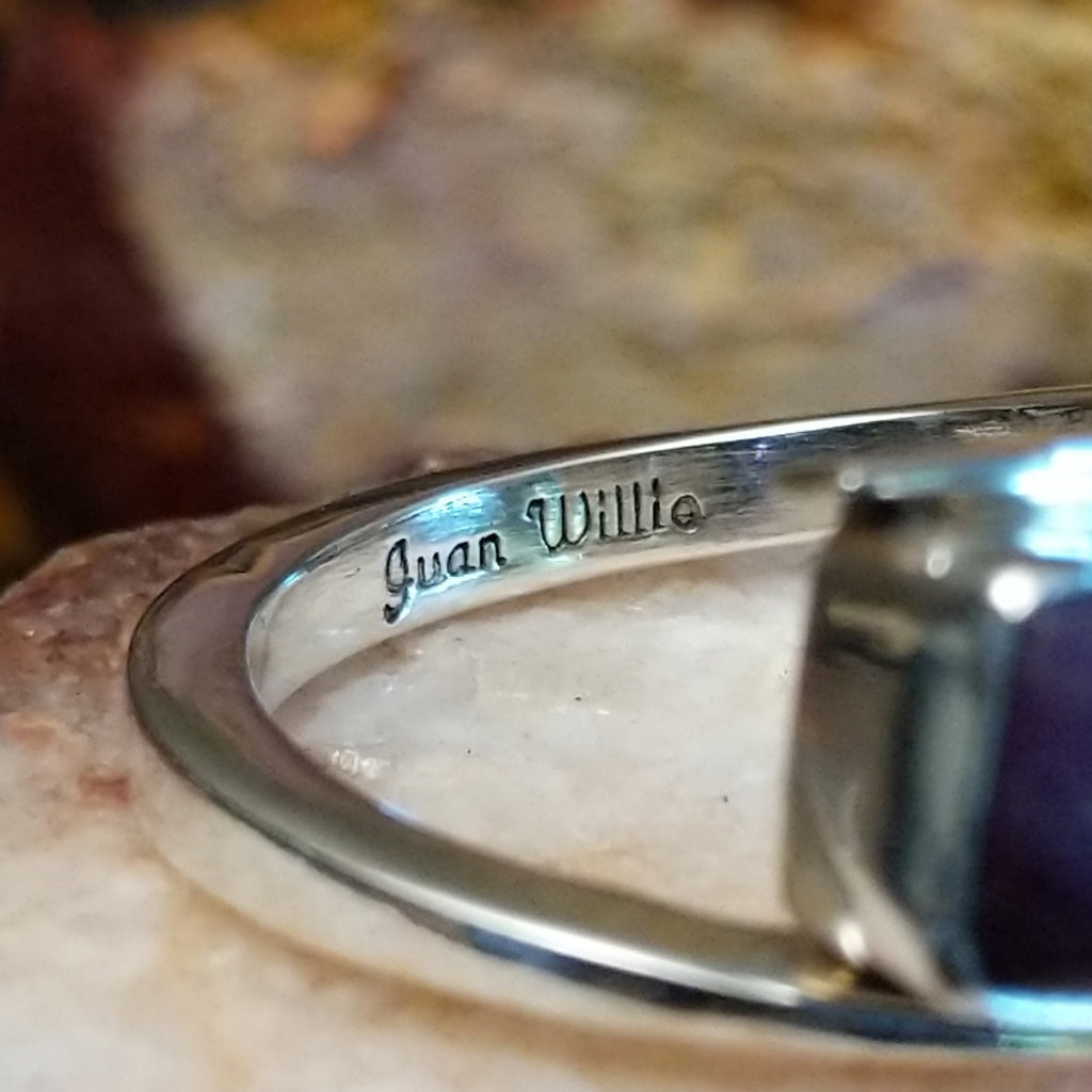 Close-up of the artisan's stamped signature.