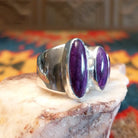 Sterling silver ring with unique bezels featuring sugilite set within.