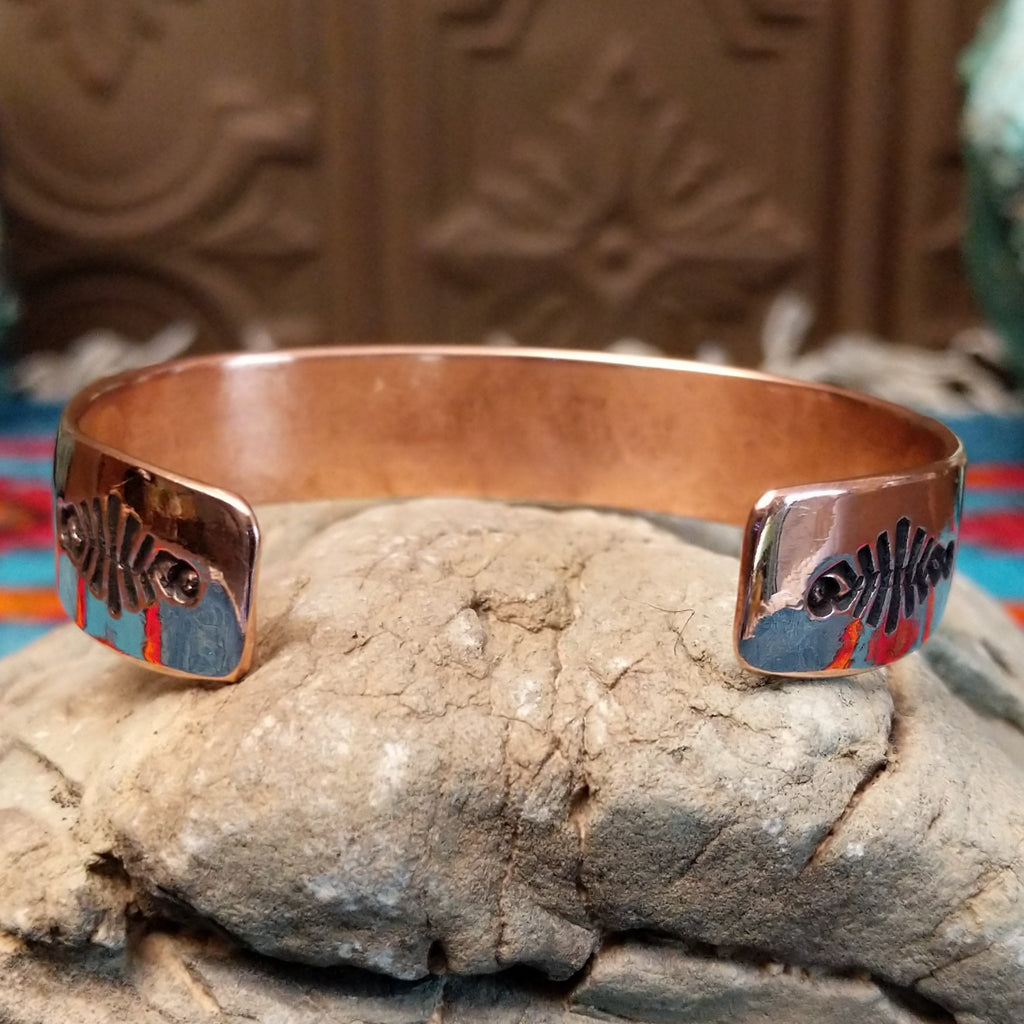 Copper and sterling silver cuff with sun beam stamping and polished finish.