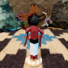 Mini Sunface kachina by Rosalind Grey with turquoise circular face, feathered halo, and white geometric-patterned garment.