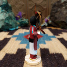 Mini Sunface kachina by Rosalind Grey with turquoise circular face, feathered halo, and white geometric-patterned garment.