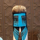A close-up of the vibrant blue face with expression.