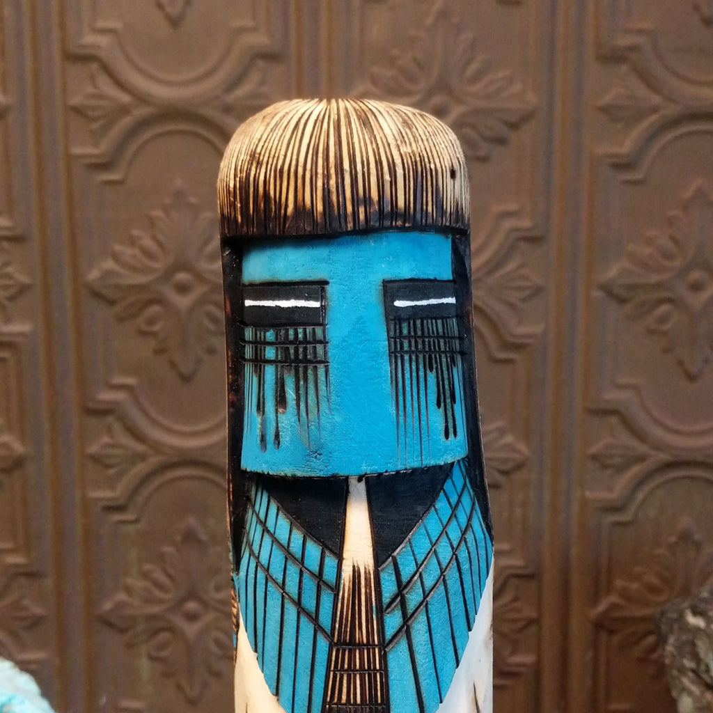 A close-up of the vibrant blue face with expression.