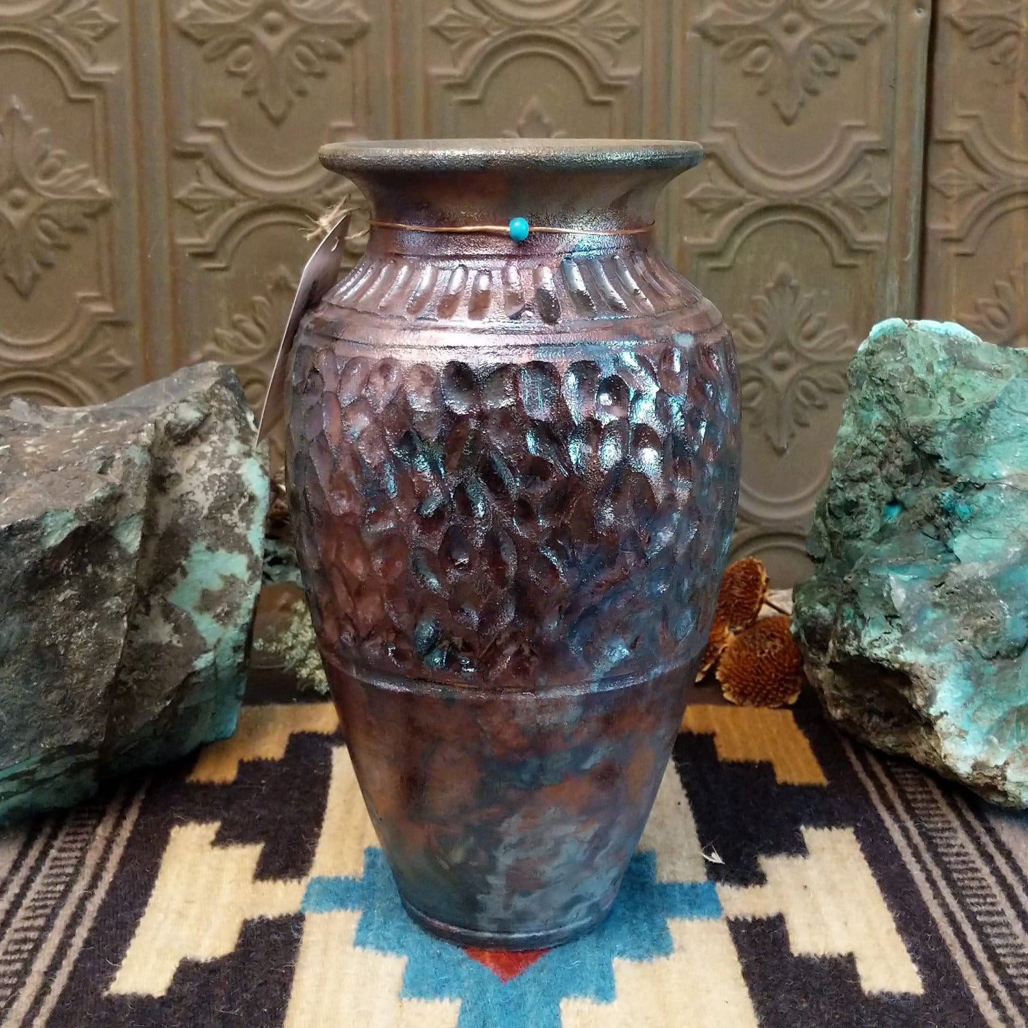 Ceramic and copper dimpled pottery vase.