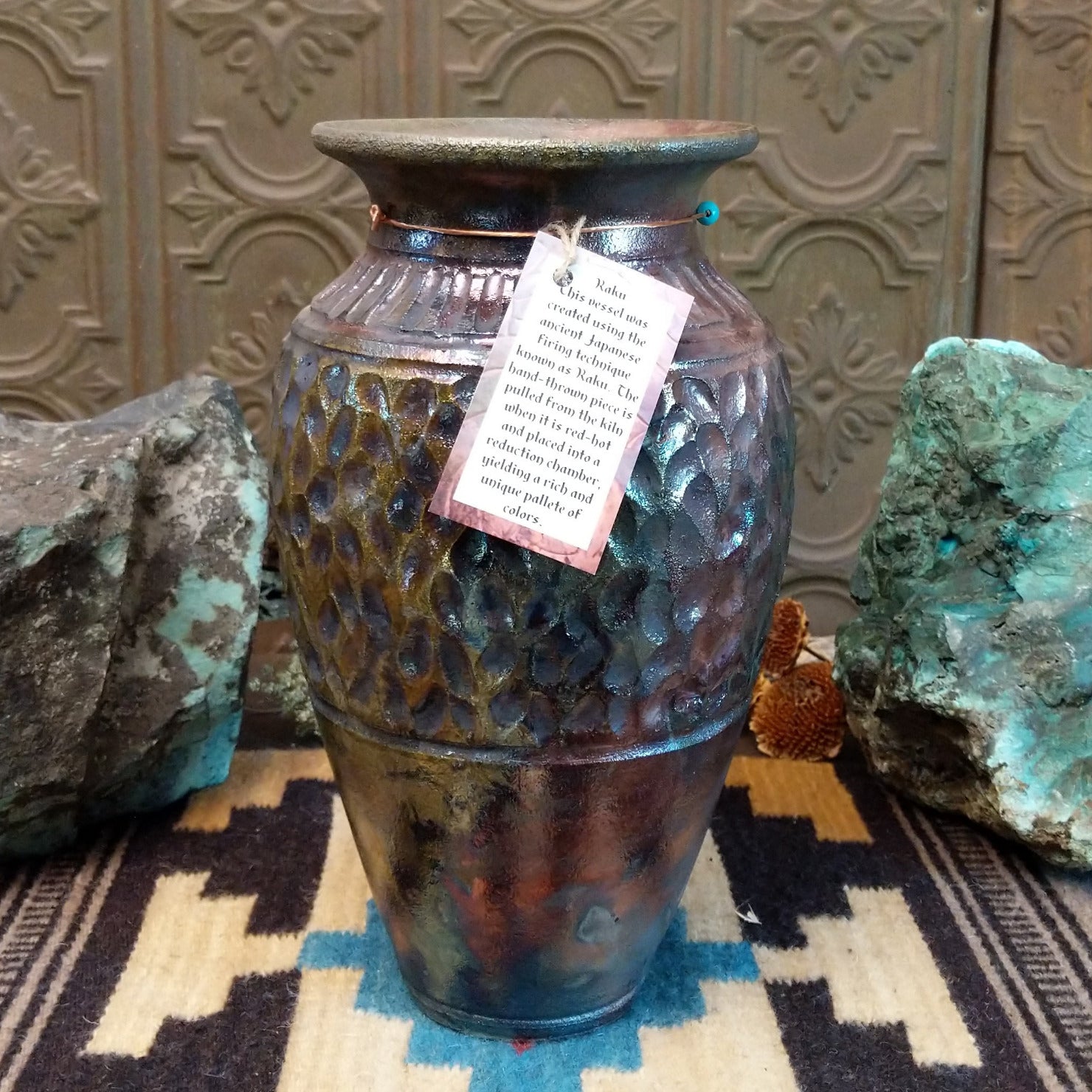 Ceramic and copper dimpled pottery vase.