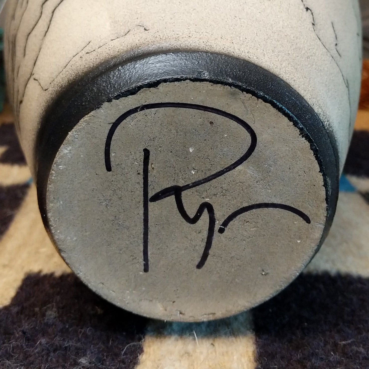 Close-up of the artisan's signature.