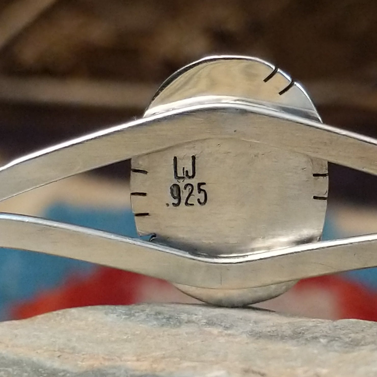 Close-up of the artisan's stamped signature.