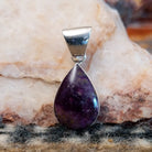 Sugilite set within a teardrop shaped sterling silver bezel.