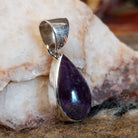Sugilite set within a teardrop shaped sterling silver bezel.