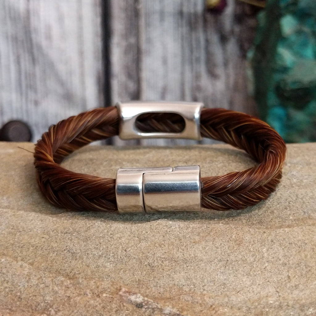 Magnetic clasp on the back of the bracelet.