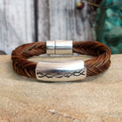 A braided brown horsehair bracelet with barbed wire detailing.