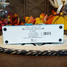The underside of the base contains information about the piece.