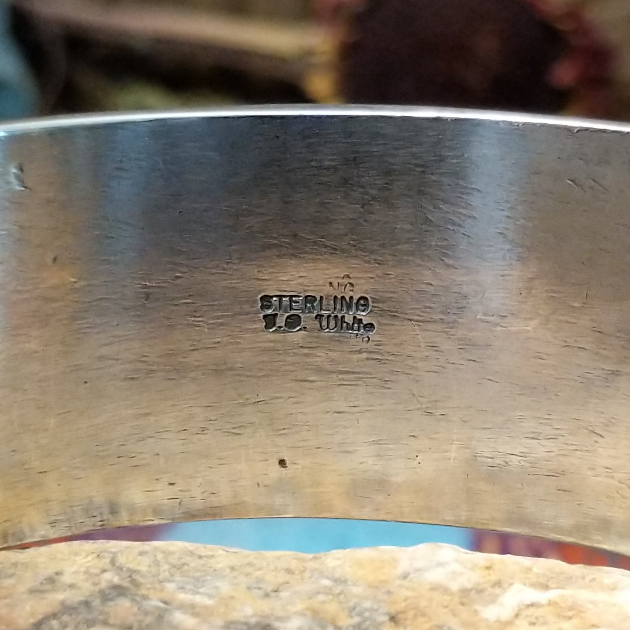 Close up of the artist's stamped signature