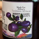 Bottle of huckleberry jam showing the ingredients