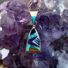 14kt gold Donald Douglas triangular pendant with geometric multistone inlay.