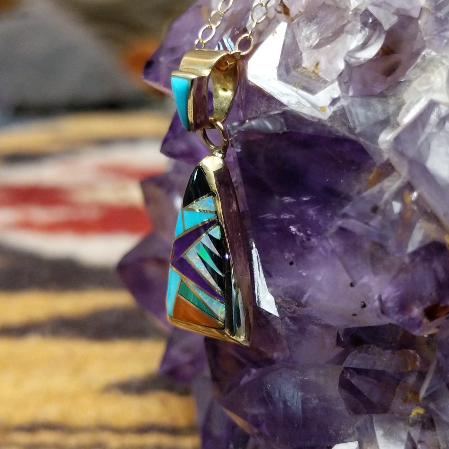 14kt gold Donald Douglas triangular pendant with geometric multistone inlay.