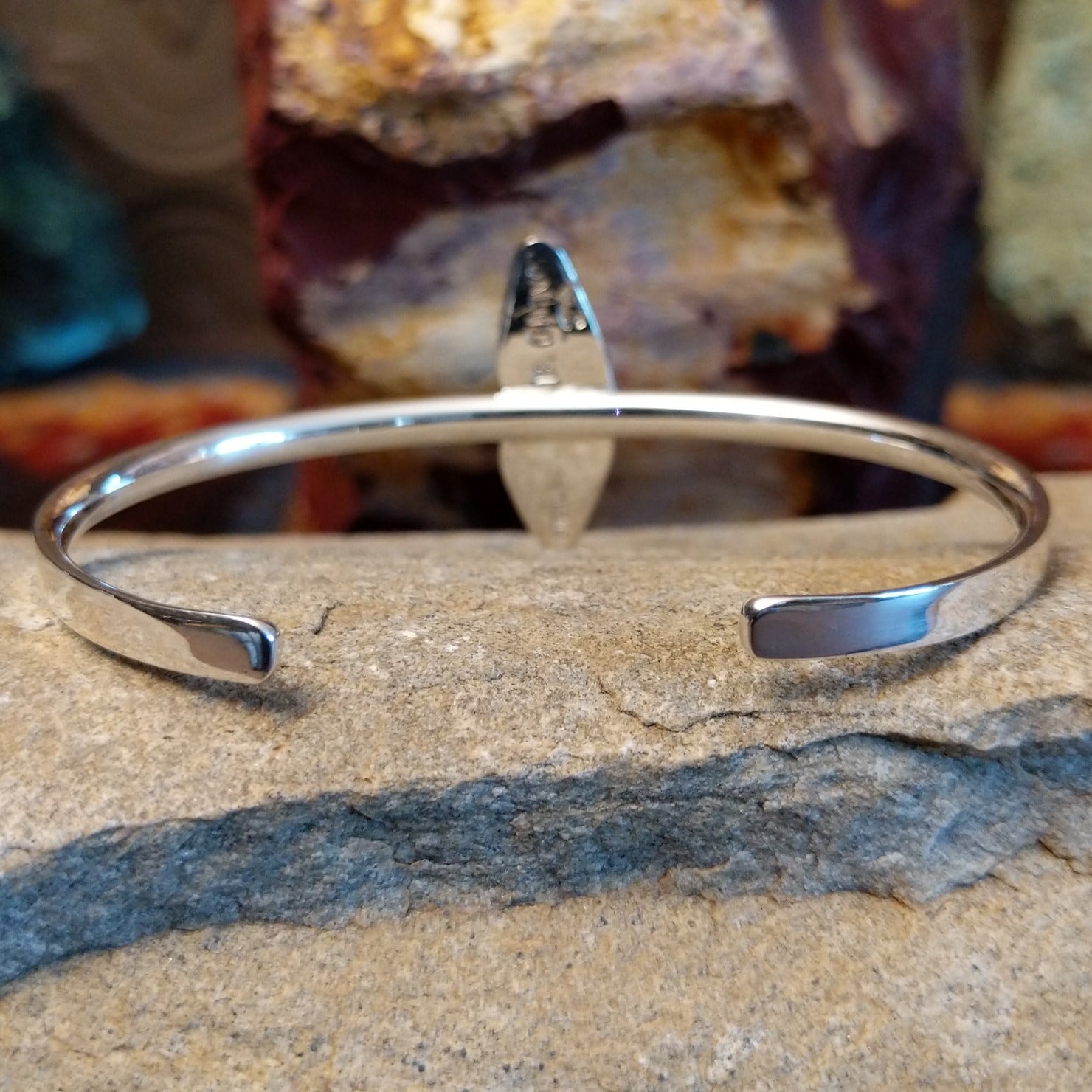 The back of the cuff showcases the thin polished silver band.