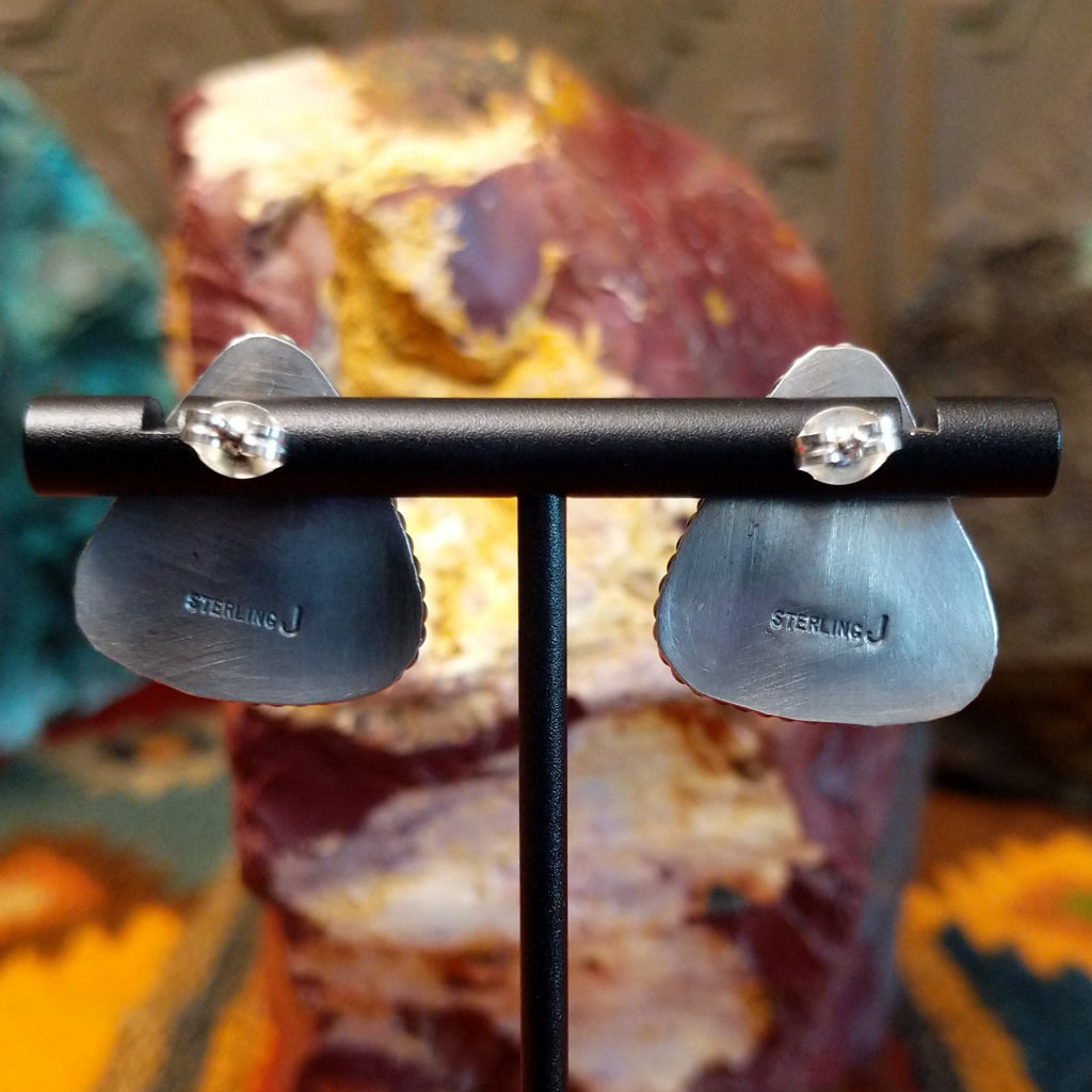 The back is stamped with the authentication and signature.