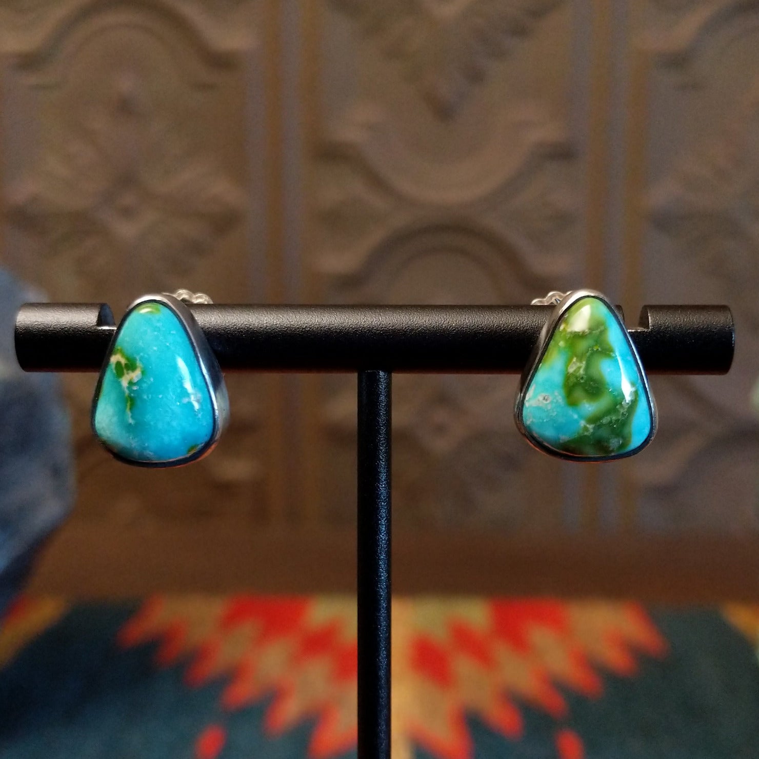 Sterling silver triangular post earrings with sonoran gold turquoise set in the bezels.