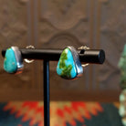 Sterling silver triangular post earrings with sonoran gold turquoise set in the bezels.