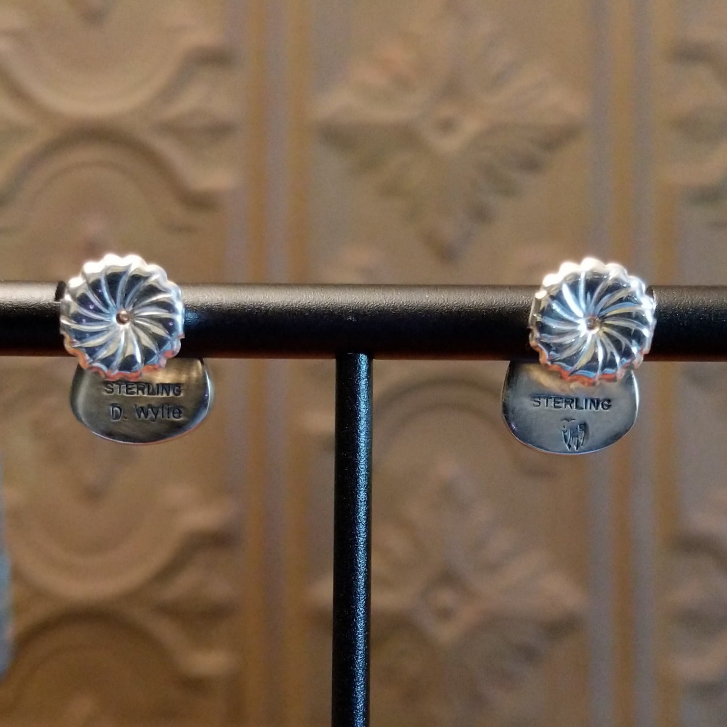 Close-up of the artisan's stamped signature.