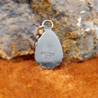The back of the ring features the artisan's initials stamped.