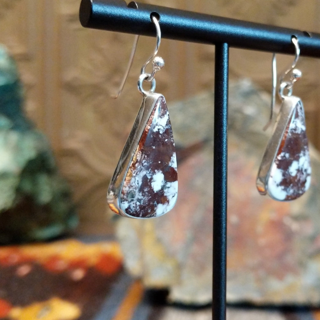 Triangular wild horse stone set in a smooth silver bezel.