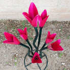Close-up reveals the glossy pink finish and subtle light pink accents of the petals.