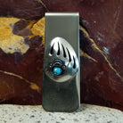 A turquoise bear paw shadowbox on the face of the clip.