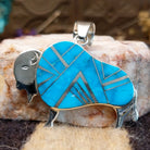 Sterling silver bison pendant with turquoise inlaid.