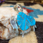 Sterling silver bison pendant with turquoise inlaid.