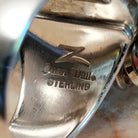 Close-up of the artisan's stamped signature.