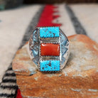 Turquoise and coral silver ring by Pauline Nelson with stamped arrow designs.