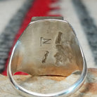 Close up of the artist's stamped signature