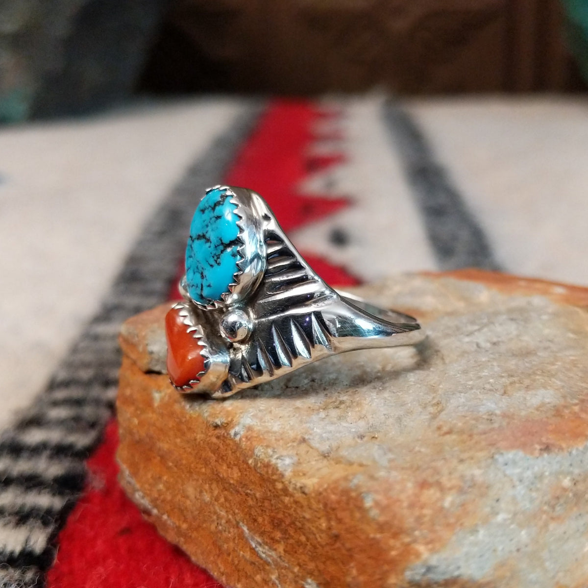 Turquoise and coral silver ring by Pauline Nelson with fan-shaped detailing.