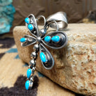 Silver dragonfly pendant with turquoise stones by Darrin Livingston. Side view. 