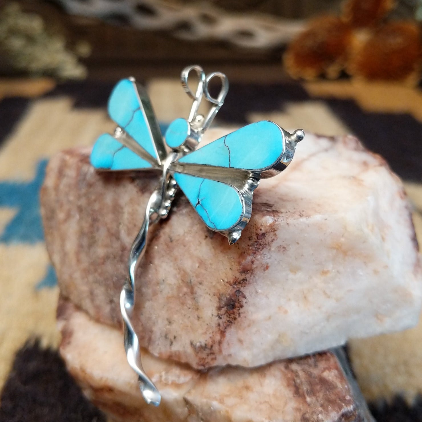 Sterling silver dragonfly pendant with turquoise set in the wings.
