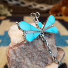 Sterling silver dragonfly pendant with turquoise set in the wings.