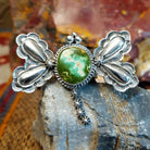 Sterling silver dragonfly pendant with twisted rope detailing and turquoise set in the bezel.