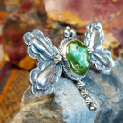 Sterling silver dragonfly pendant with twisted rope detailing and turquoise set in the bezel.