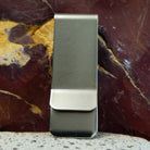 Smooth stainless steel backing of the clip.
