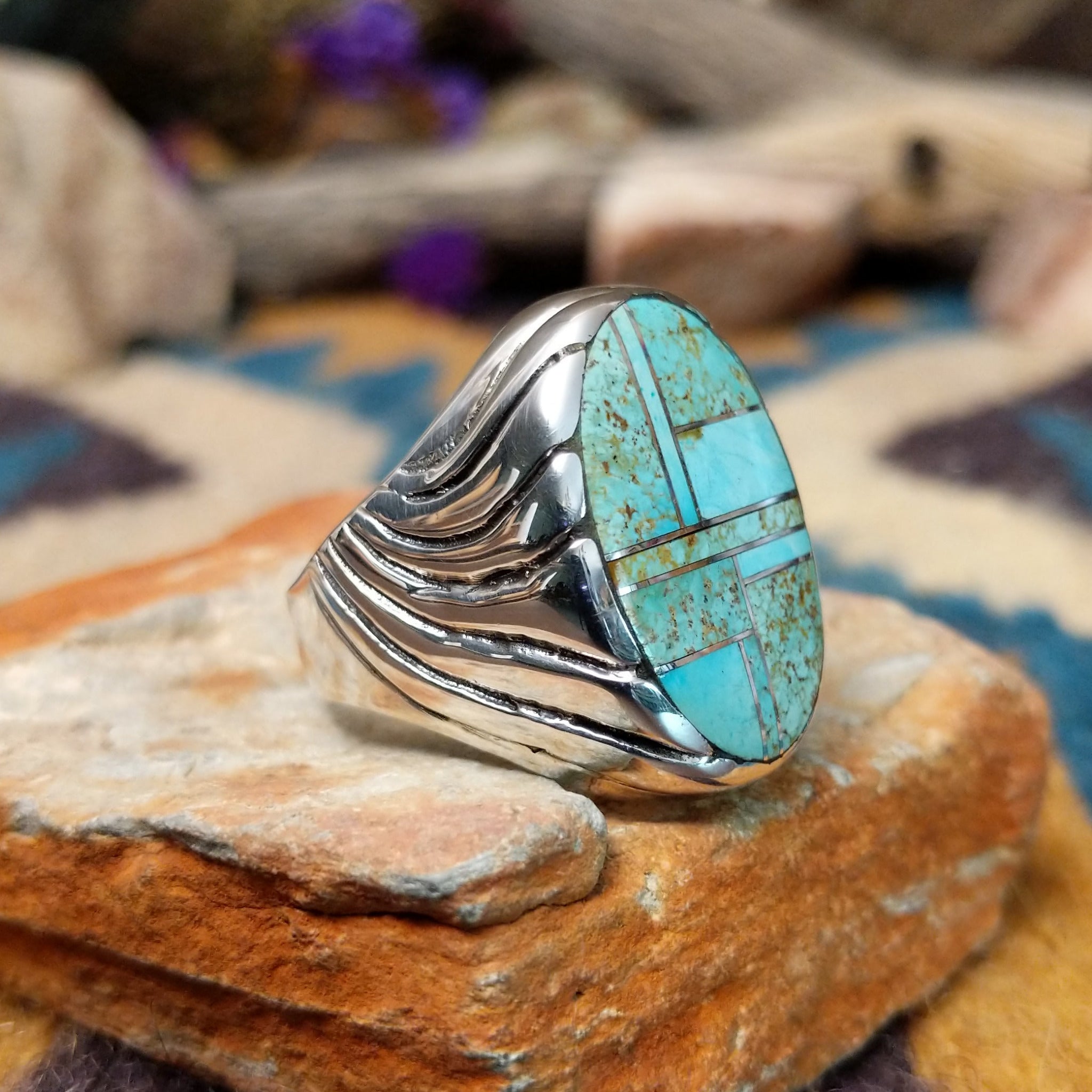 Sterling silver Turquoise inlay ring by Dennis Ramone with an oval geometric mosaic design; side view.